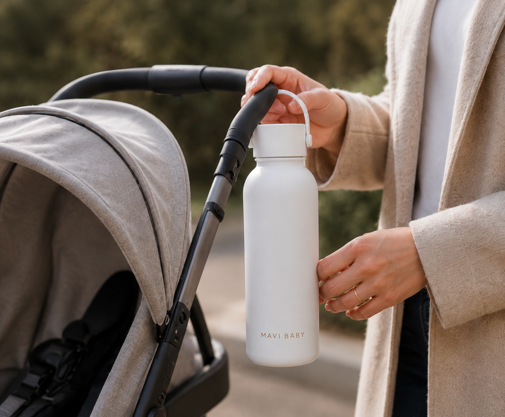Mavi Baby Thermos in white clipped to a pram — insulated baby bottle water warmer for feeds on walks